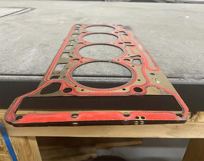 Red head gasket removed from car