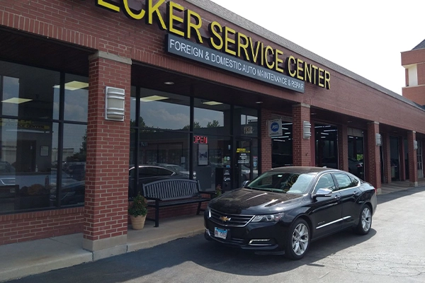 Grey Chevrolet Impala sitting in front of Becker Service Center