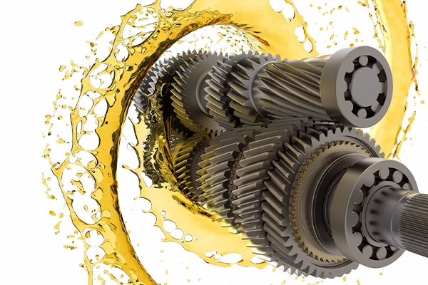 transmission gears and oil on a white background